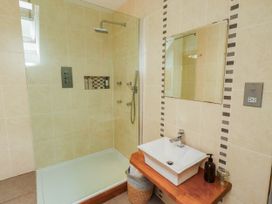 A bathroom with a shower and sink at Alma House in Seahouses