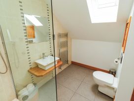 A bathroom with a shower and sink at Alma House in Seahouses