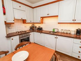 A kitchen with cabinets and appliances at Spinnaker
