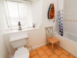 A bathroom with a shower and toilet at Spinnaker