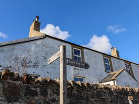 A building and signpost at Spinnaker