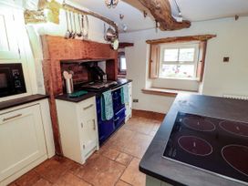 A kitchen with stove and cabinets at Claybottom Farm near Hesket Newmarket