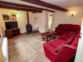 A living room with a sofa and television at Claybottom Farm Hesket Newmarket