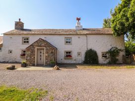 A cottage exterior with stone details at Claybottom Farm Hesket Newmarket