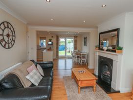 A living room with a sofa and coffee table at The Cosy Haven in Malton