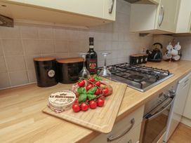 A kitchen with cooking items and ingredients at The Cosy Haven in Malton