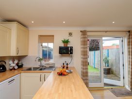 A kitchen with a counter and sink at The Cosy Haven in Malton