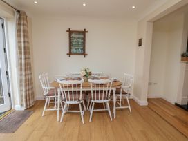 A dining room with a table and chairs at The Cosy Haven in Malton