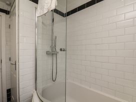 A bathroom with a bathtub and a shower at The Cosy Haven in Malton