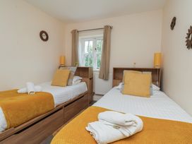 A bedroom with two beds and a window at The Cosy Haven in Malton