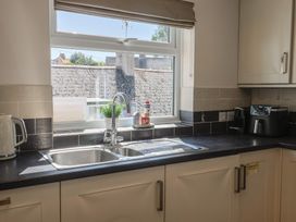 A kitchen with a sink and kettle at 2 Mill Green Court in Lyme Regis