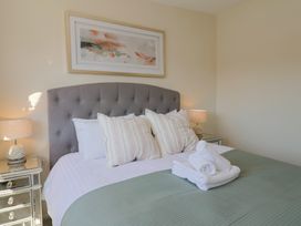 A bedroom with a bed and pillows at 2 Mill Green Court Lyme Regis