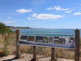 A sign at the Jurassic Coast World Heritage Site overlooking the ocean at 2 Mill Green Court Lyme Regis