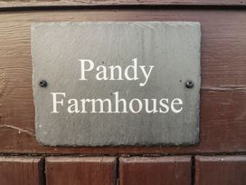 A nameplate reading Pandy Farmhouse