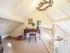 A landing with a desk and chair at Pandy Farmhouse