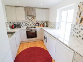 A kitchen with appliances and countertops at Wayside in Moreton-in-Marsh
