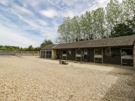 An outdoor stable area with horse stalls at Wayside in Moreton-in-Marsh