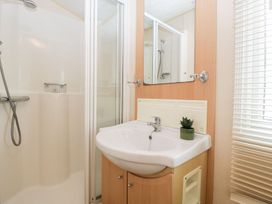 A bathroom with a shower and sink at The Hideaway in Portesham