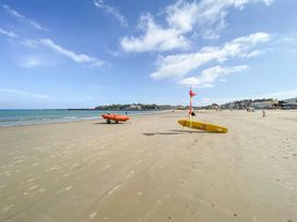 A beach with lifeguard equipment at The Hideaway in Portesham