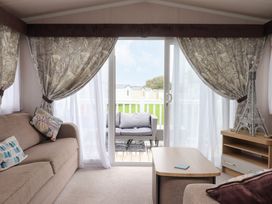 A living room with a sofa and table at Marton Mere Westminster in Blackpool