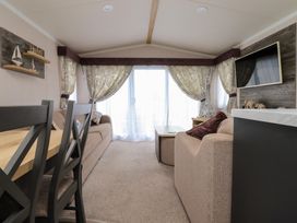 A living room with a sofa and table at Marton Mere Westminster in Blackpool