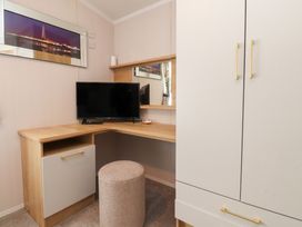 An office with a desk and a TV at Marton Mere Westminster in Blackpool