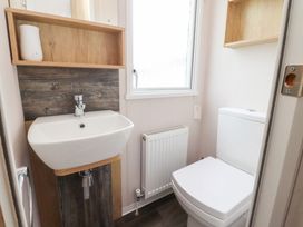 A bathroom with a sink and toilet at Marton Mere Westminster in Blackpool