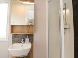 A bathroom with a sink and shower at Marton Mere Westminster in Blackpool