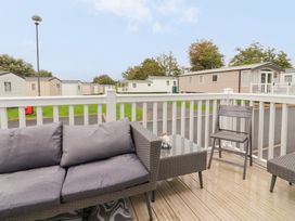 An outdoor seating area with a sofa and table at Marton Mere Westminster in Blackpool
