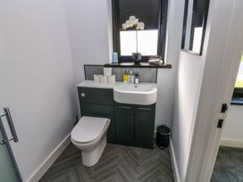 A bathroom with a sink and toilet at Sycamore Cottage Frizington