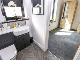 A bathroom with a sink and toilet at Sycamore Cottage in Frizington