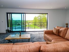 A living room with a sofa and coffee table at Oak Tree Cottage in Frizington