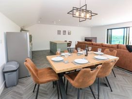 A dining area with a table and chairs at Oak Tree Cottage in Frizington