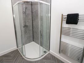 A shower and towel rail in Oak Tree Cottage Frizington