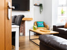 A living room with a coffee table and television at 38 Ashville Avenue in Scarborough