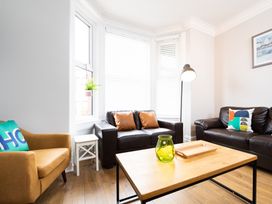 A living room with two sofas and a coffee table at 38 Ashville Avenue Scarborough