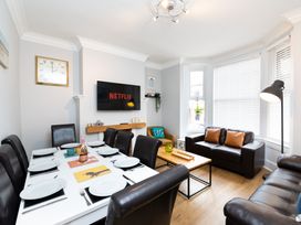 A dining room with a table and chairs at 38 Ashville Avenue, Scarborough
