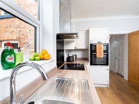 A kitchen with a sink and oven at 38 Ashville Avenue, Scarborough