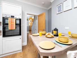 A kitchen with an oven and breakfast items at 38 Ashville Avenue Scarborough