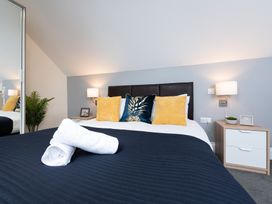 A bedroom with a bed and bedside table at 38 Ashville Avenue Scarborough