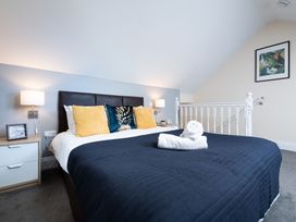 A bedroom with a bed and bedside tables at 38 Ashville Avenue Scarborough