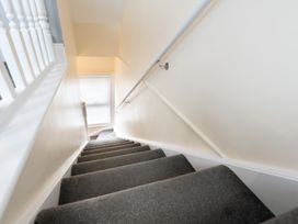 A stairwell with stairs and a handrail at 38 Ashville Avenue Scarborough