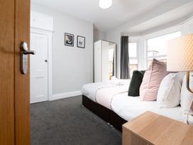 A bedroom with a bed and wardrobe at 38 Ashville Avenue Scarborough
