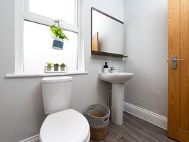 A bathroom with a sink and toilet at 38 Ashville Avenue in Scarborough