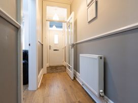 A hallway with a door and radiator at 38 Ashville Avenue Scarborough