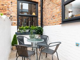 Outdoor seating area with table and chairs at 38 Ashville Avenue Scarborough