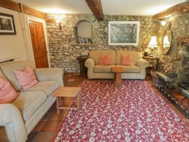 A living room with a sofa and coffee table at Ty Mawr Country House in Carmarthen