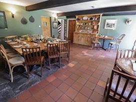 A dining room with a table set for breakfast at Ty Mawr Country House in Carmarthen