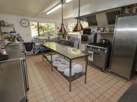 A kitchen with stainless steel countertops and appliances at Ty Mawr Country House in Carmarthen