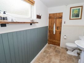 A bathroom with a toilet and sink at Ty Mawr Country House in Carmarthen